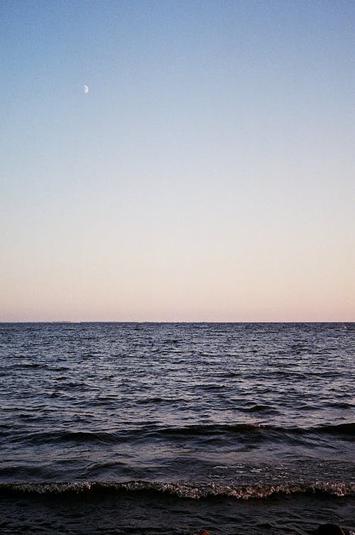 A Body of Water Under the Clear Sky