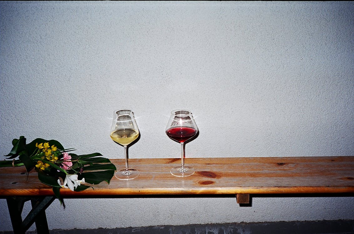 Free Wine Glasses on Brown Wooden Bench Stock Photo