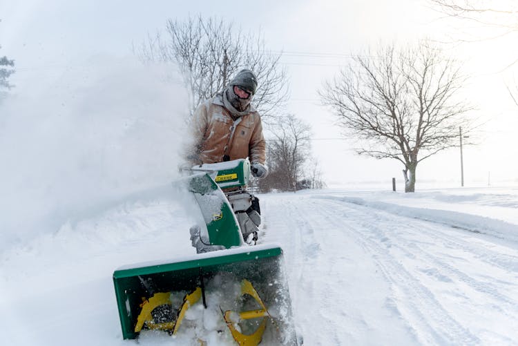 Man With Snow Blower On The Road