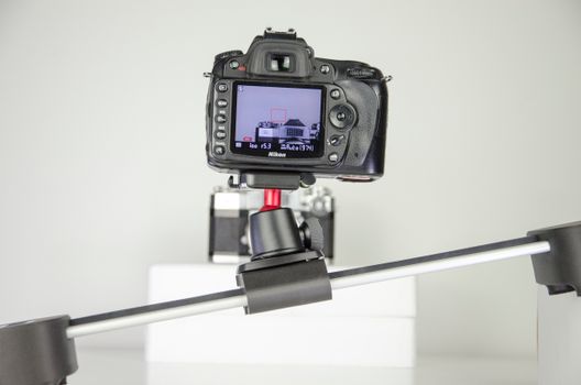 Camera on a stabilizer capturing a clean studio setup with precision.