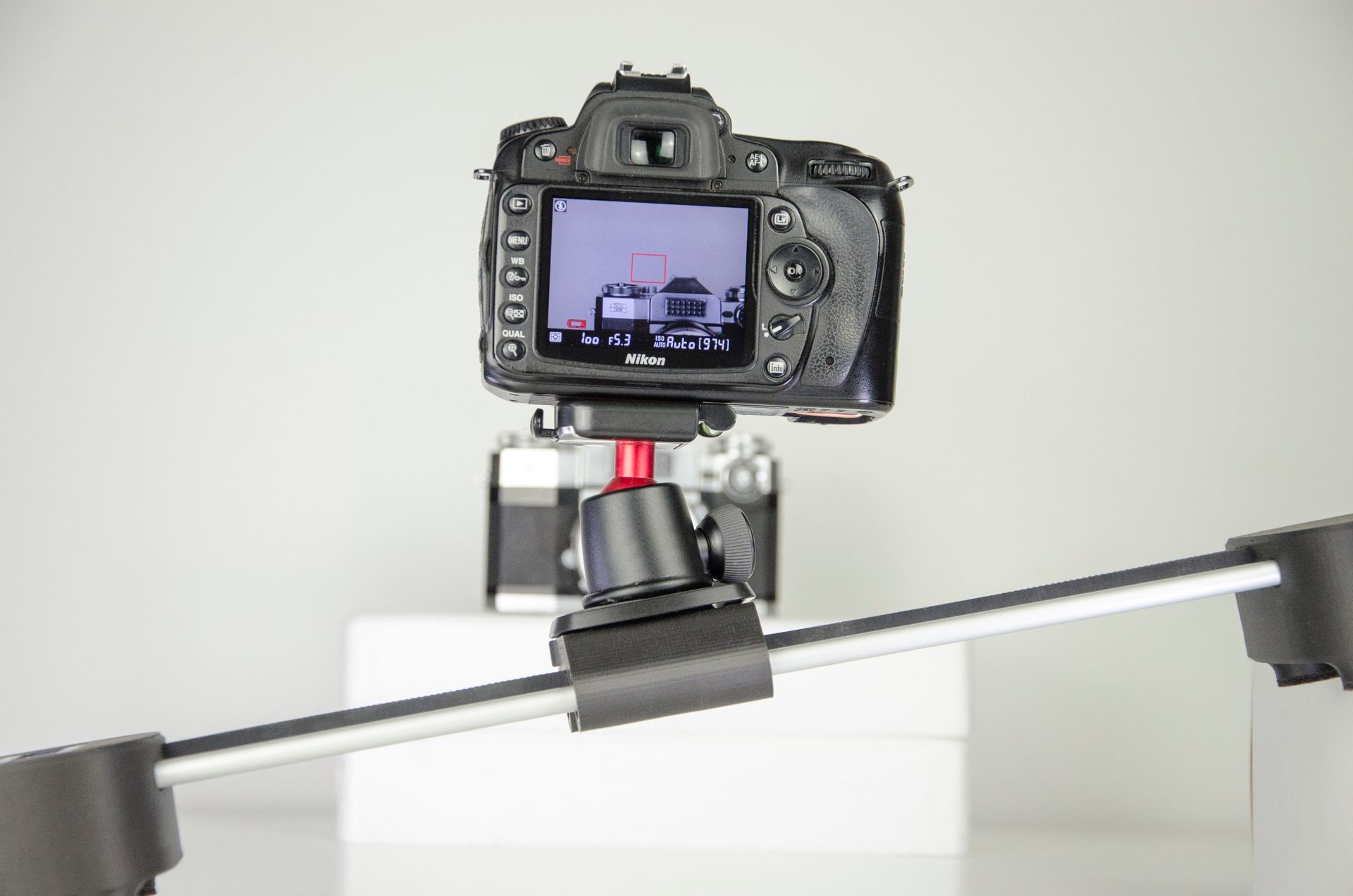 Camera on a stabilizer capturing a clean studio setup with precision.