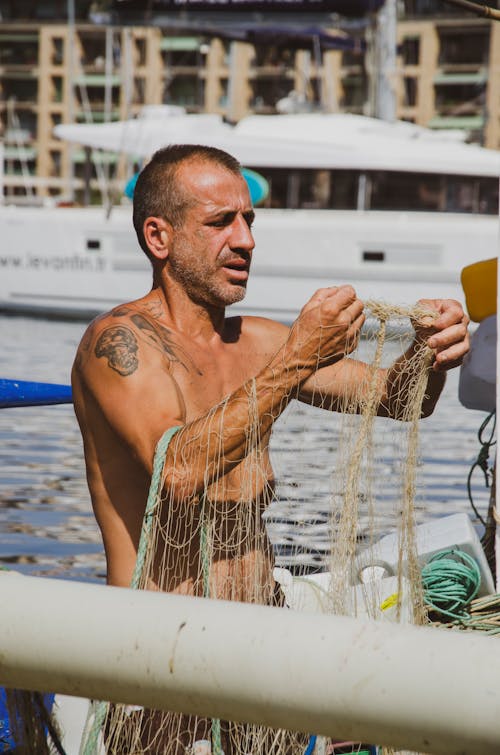 Free Photography of Half-naked Fisherman Stock Photo