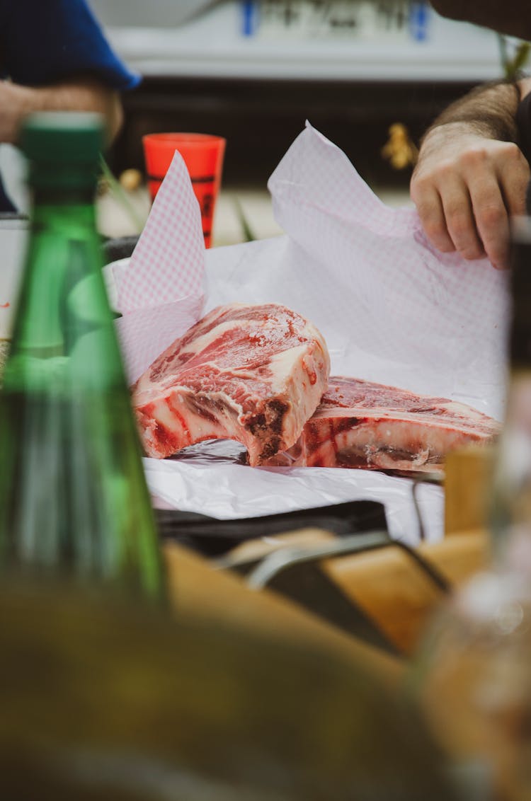 Human Hands Packing Meat 