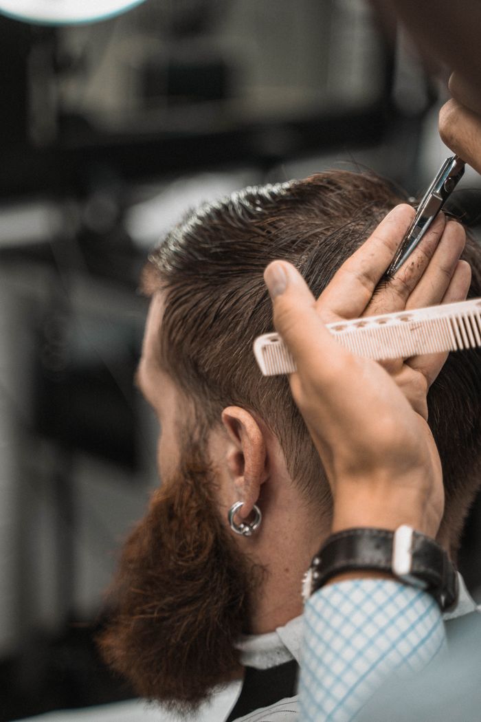 Scissor work through the top of a textured cut