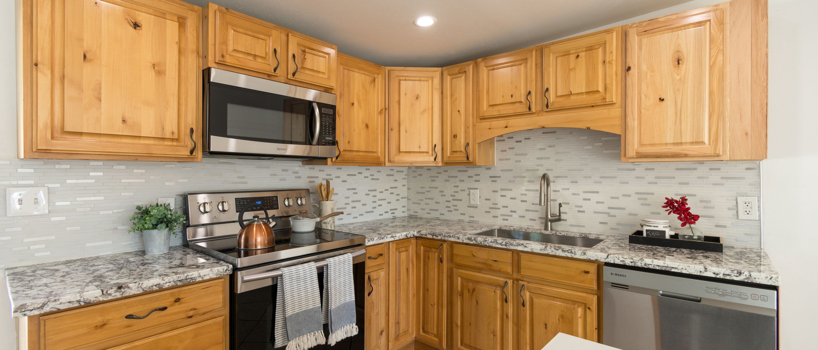 Kitchen Spraying in Wealdstone — careful masking before painting begins