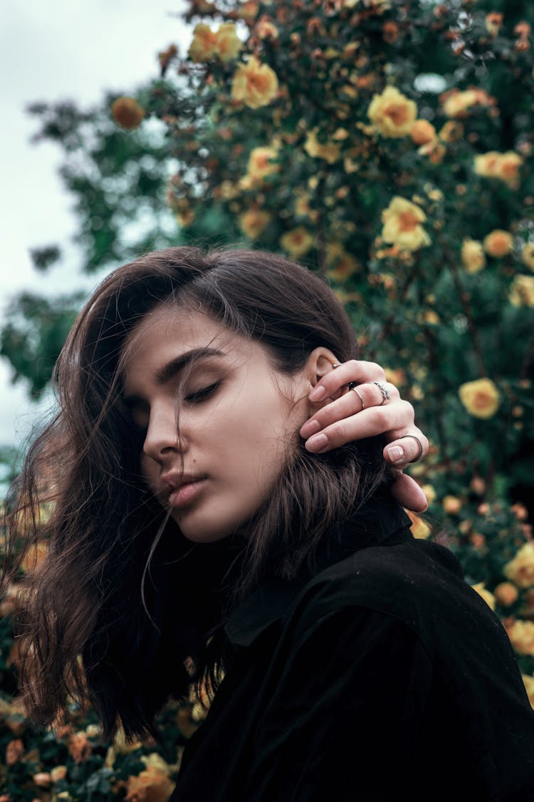 A Woman Fixing Her Hair