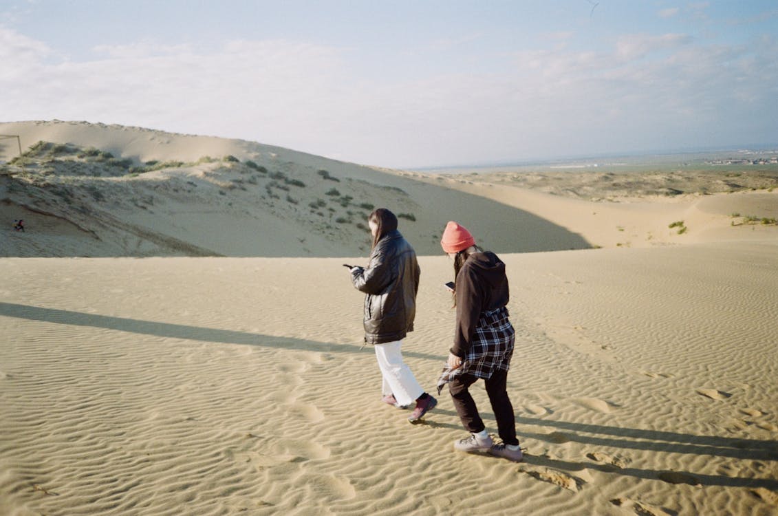 Women Walking on Dune