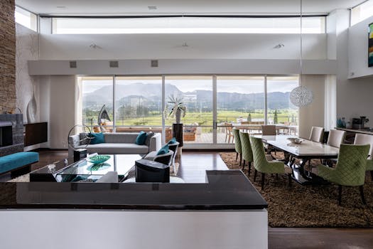 Modern open space featuring a living and dining area with mountain views in Sopó, Colombia.