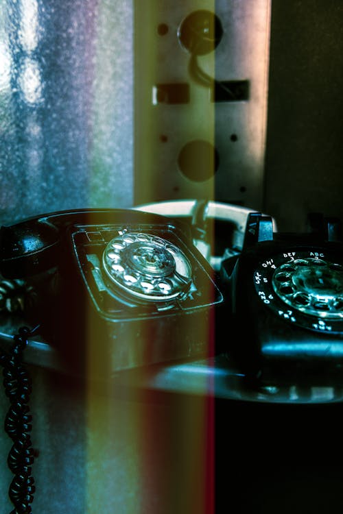 Black Telephones on the Table