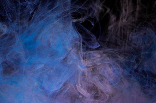 Free Abstract smoke pattern with blue and purple hues creating a dynamic visual effect. Stock Photo