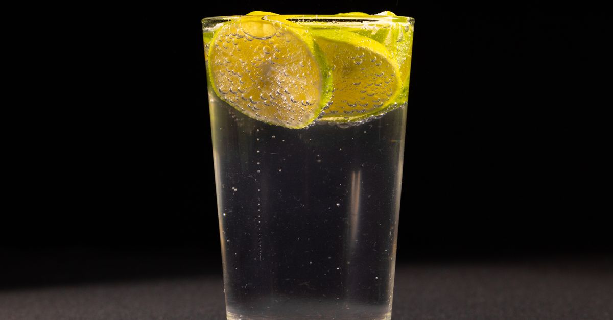 Close-up of a refreshing lemon and lime sparkling drink in a glass, perfect for a cool, invigorating experience.
