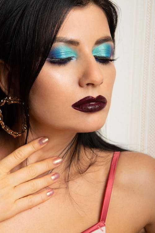 Woman with Blue Eye Shadow Wearing a Loop Earring