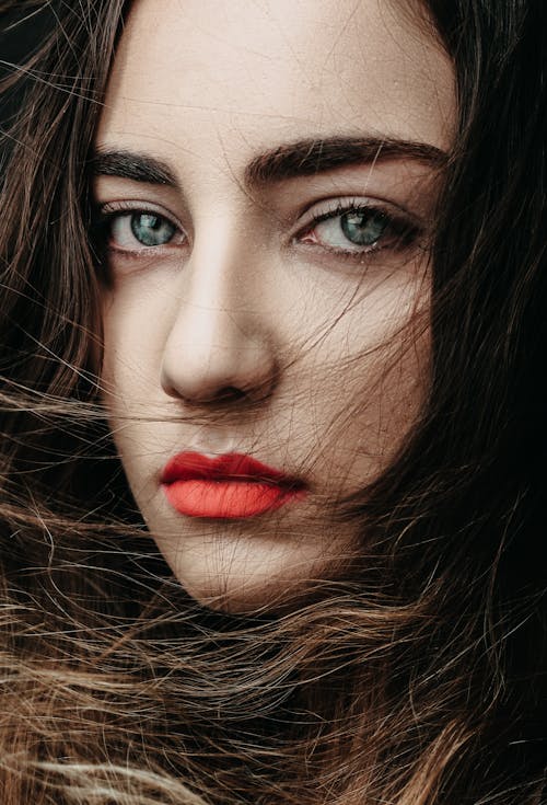 A Beautiful Woman with Green Eyes and Red Lips