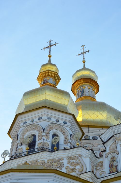 Free Golden domes and intricate details of an Orthodox cathedral against a clear sky. Stock Photo