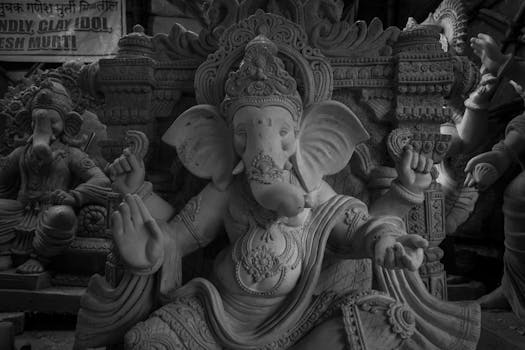Monochrome photograph of a detailed Ganesha statue in Mumbai, India.