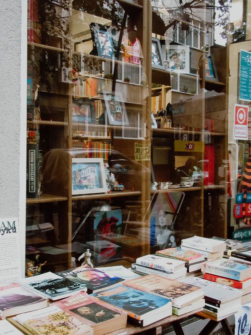 Free Books and artifacts are displayed in a window of a bookstore in Istanbul. Stock Photo