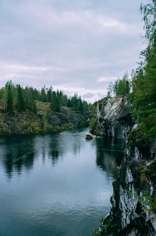 Free Explore the tranquil beauty of a lake surrounded by lush greenery in Karelia, Russia. Stock Photo