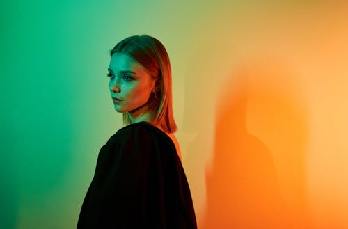 Portrait of Young Beautiful Woman with Colorful Background