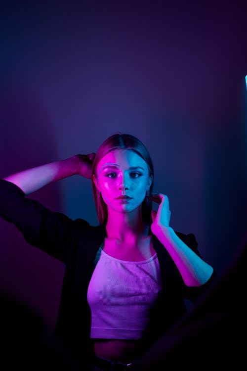 Portrait Young Woman in Neon Light · Free Photo
