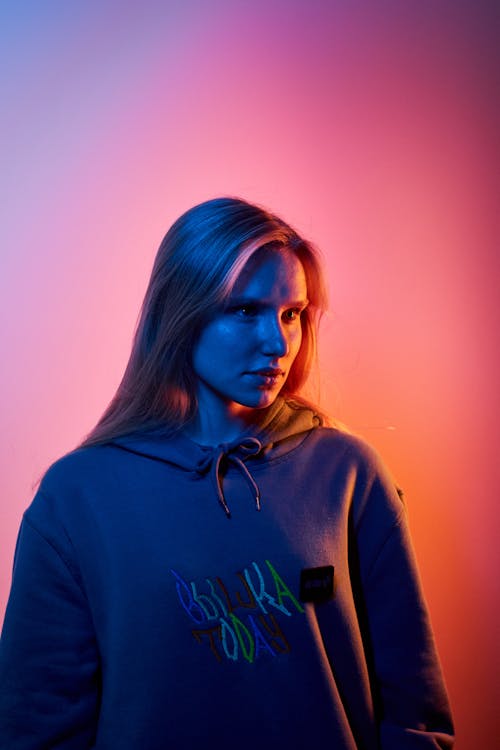 Portrait of Young Blond Woman in Neon Light