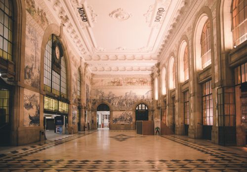 Free A stunning view of São Bento railway station's ornate interior in Porto, Portugal, showcasing its decorative tiles. Stock Photo