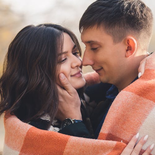 Free Close-Up Photo of a Man Holding the Cheek of a Woman Stock Photo