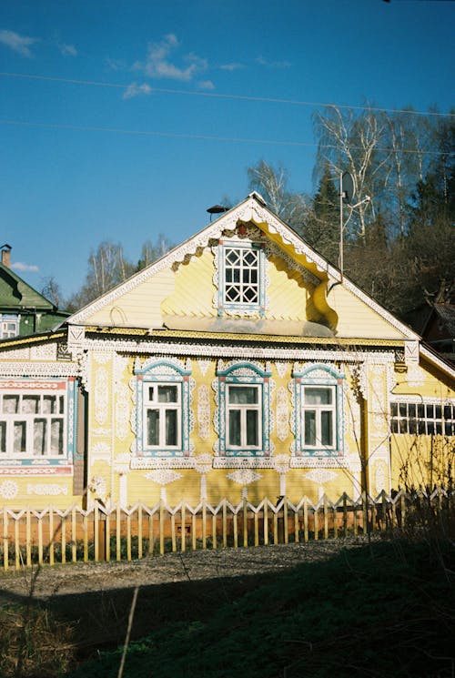 White and Yellow House under Blue Sky