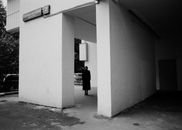 Unrecognized Female Silhouette under Concrete Structure of Block of Flats