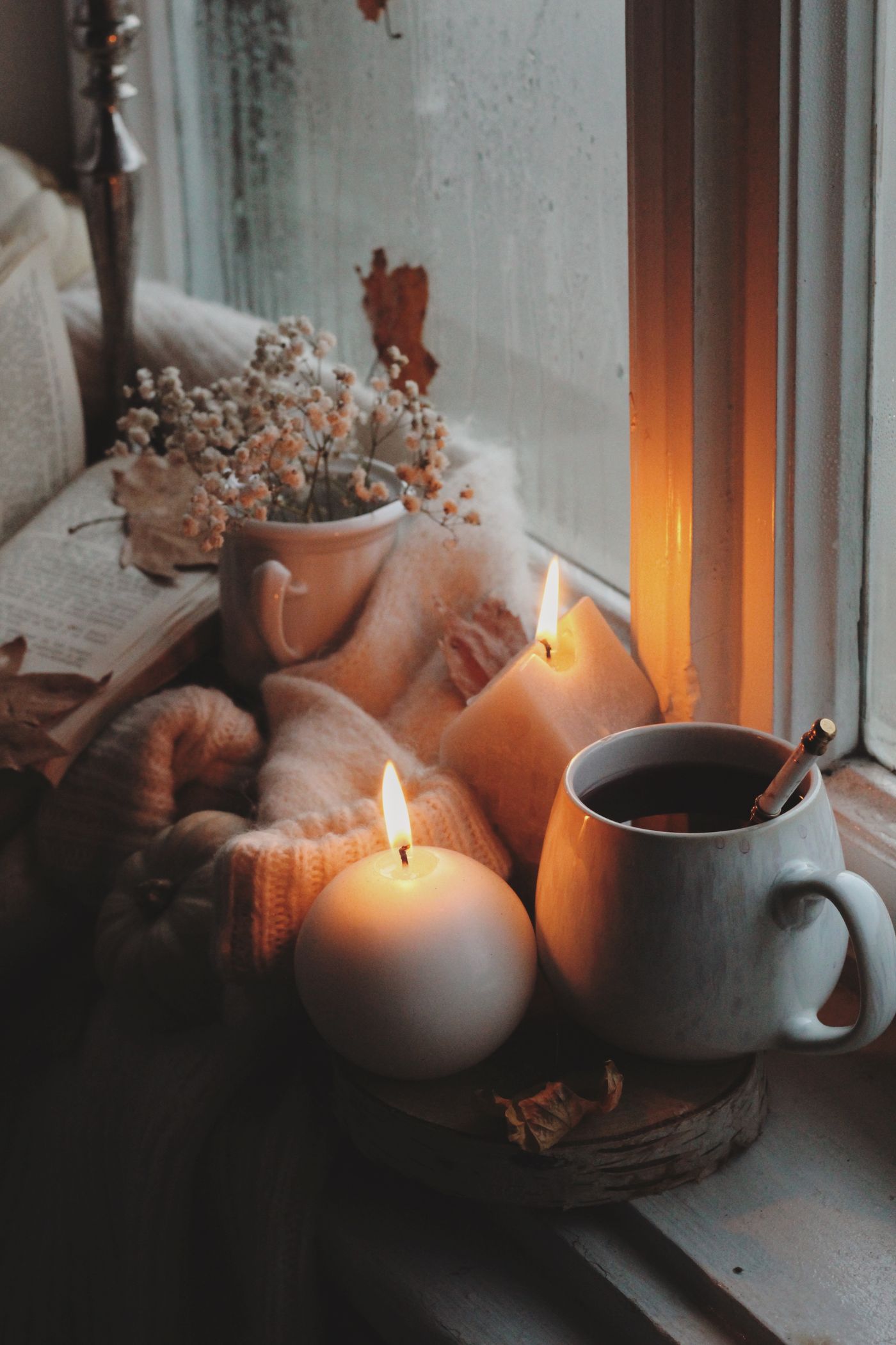 Candle and a mug of tea