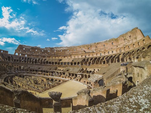 An Old Colosseum Under Blue Sky