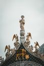 Gold and White Concrete Statue