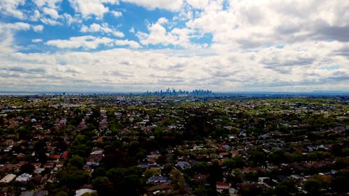 Aerial View of Melbourne Suburbs with Downtown Skyline in Distance, Australia