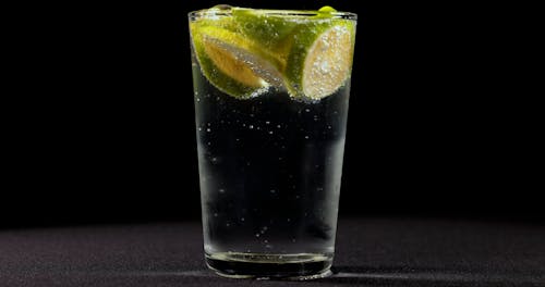 Sliced Lime Floating on a Glass With Sparkling Drink