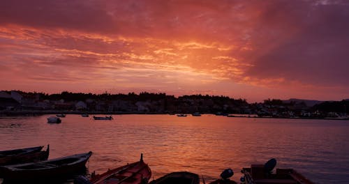 Boats in Sea at Sunset