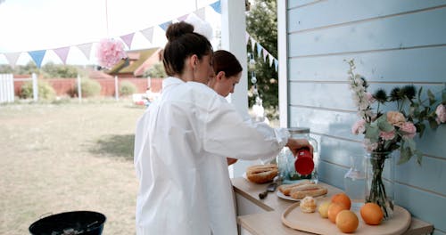 A Woman Making Hot Dog Sandwich