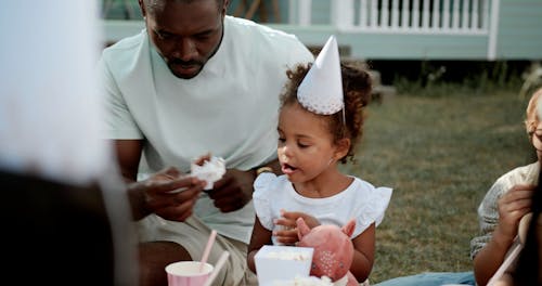 A Father and his Daughter at a Birthday Party