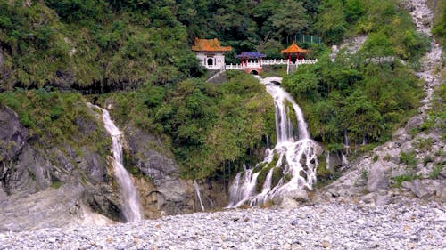 Houses by Small Waterfalls