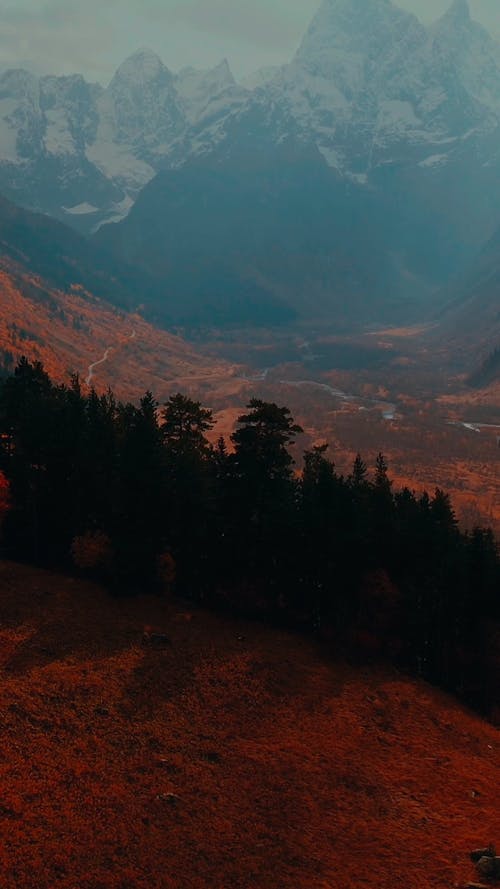 Snowcapped Mountains Covered in Fog