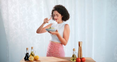 A Woman Eating a Pasta 