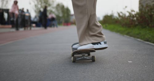 Feet of Skateboarder Doing Trick