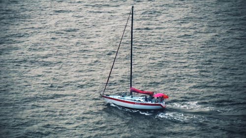 Drone Footage of a Sailboat Traveling on Water