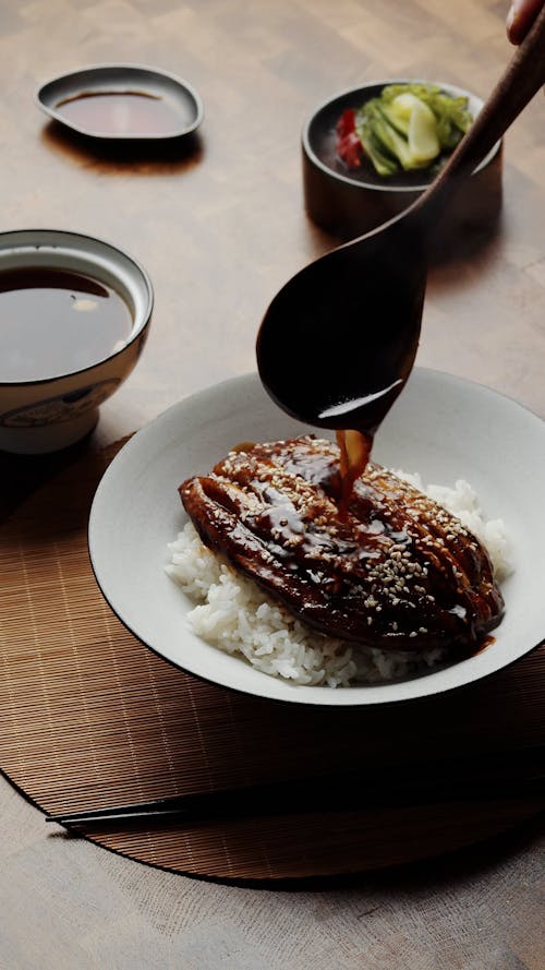 Sauce Pouring Over Rice Meal