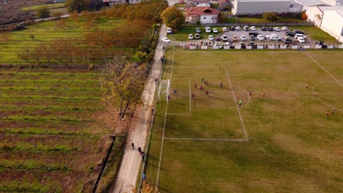 An Aerial Footage of People Playing Football