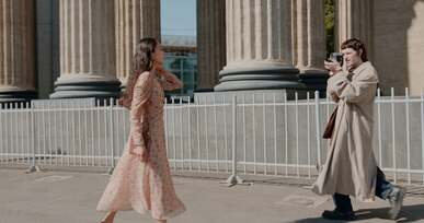 man filming a beautiful woman