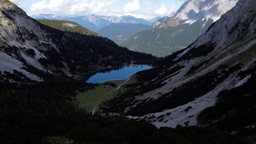 A Drone Footage of a Lake on the Mountains