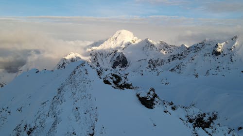 Snowcapped Mountains Covered with Clouds