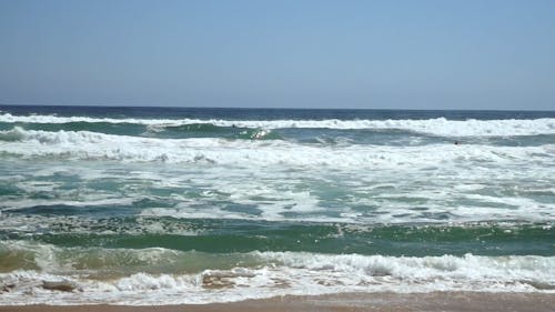 Sea Waves Reaching Beach on Coast