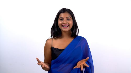 A Woman Talking while Wearing a Saree