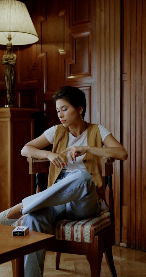 A Woman Taking a Cigarette from a Box