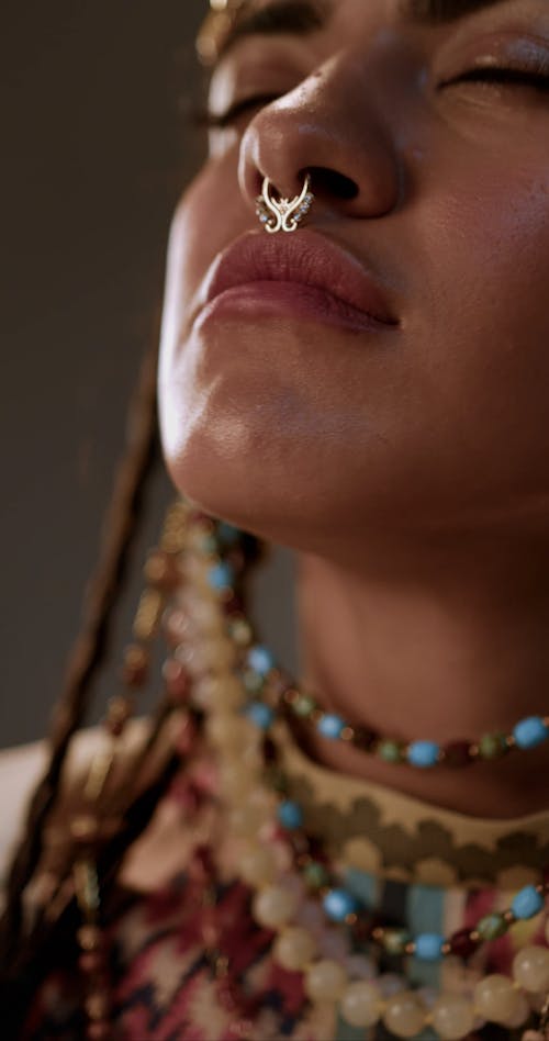 Close up on Painted Woman Face with Necklaces